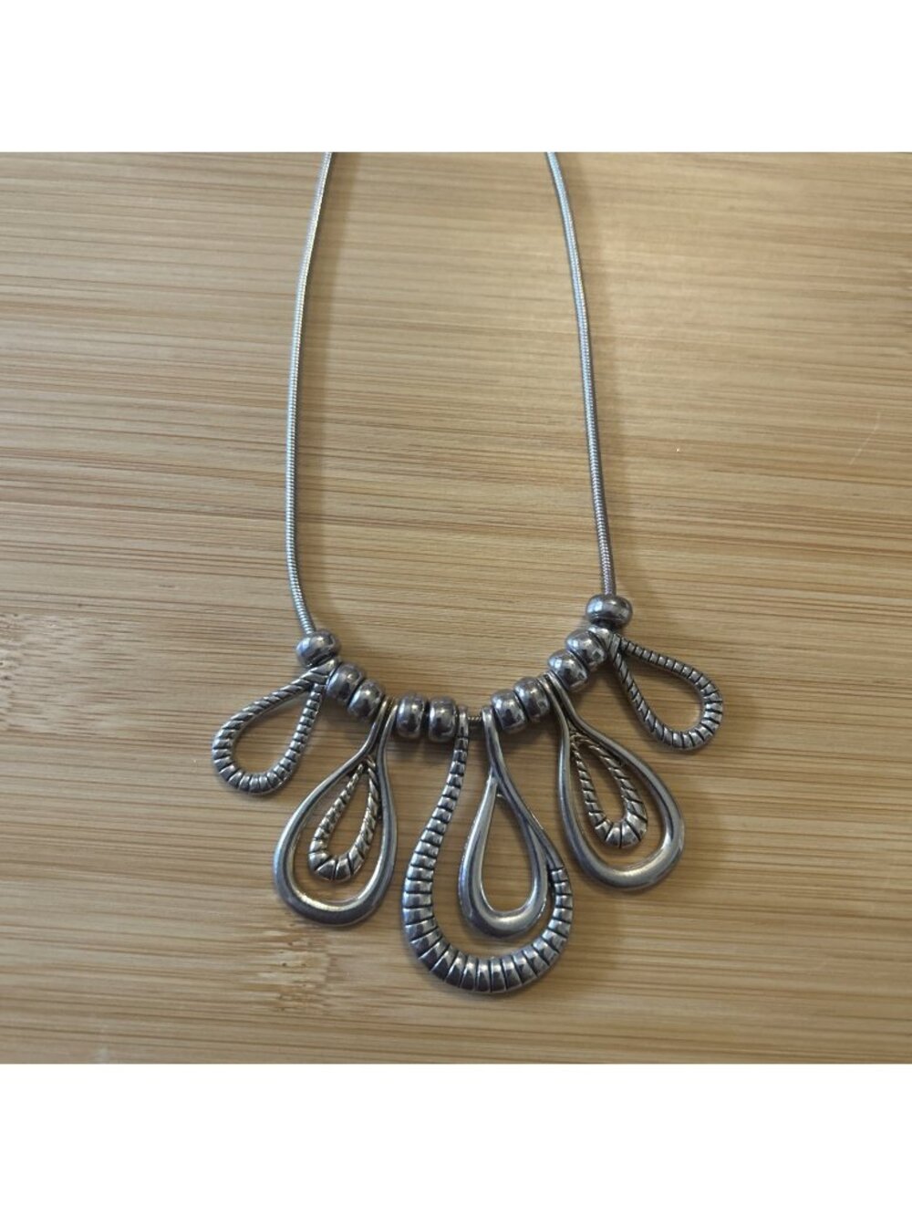 Silver Tone Ribbed Open Loop Dangle Bib Charm Snake Chain Statement Necklace